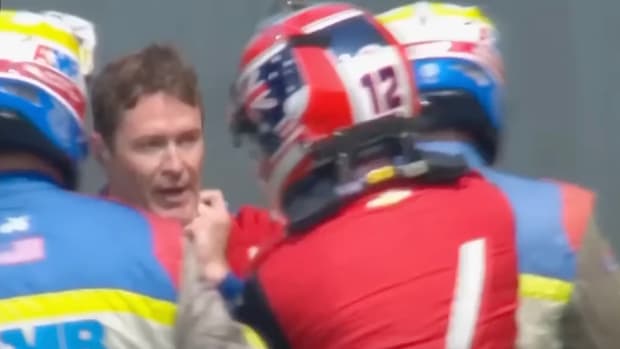 Will Power (right) grabs Scott Dixon after a crash during Saturday's practice. Image courtesy Peacock.
